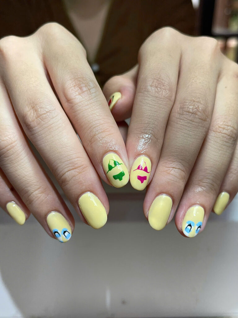 Yellow summer nails with bikini art at Art Spa 2, Hoi An
