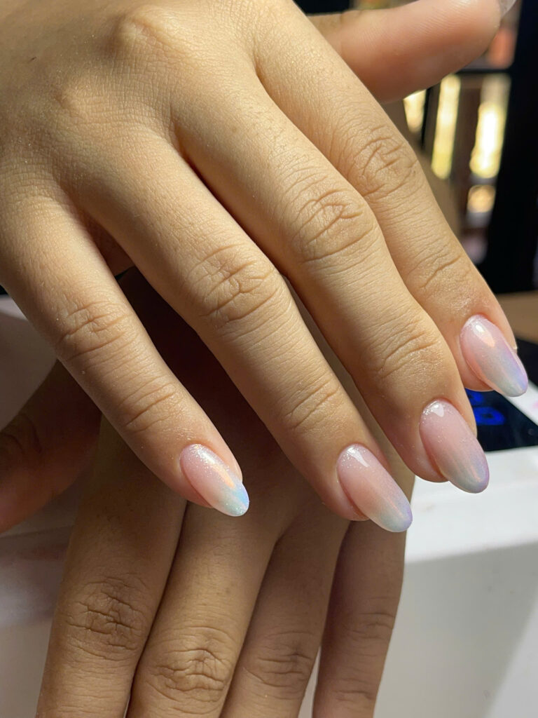 Almond gel nails with a soft pastel aurora chrome finish at Art Spa 2, Hoi An